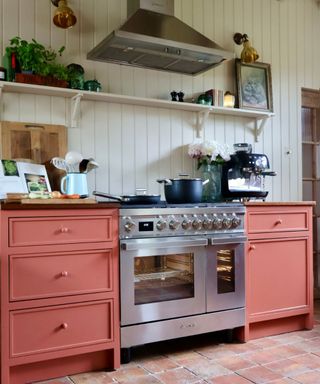 Rusty red kitchen with Smeg oven and coffee maker. Photograph Jacqueline Mercer @tinyandthehouse