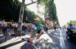 German cyclist Erik Zabel racing for Team Telekom waves to spectators as he rides his Pinarello road racing cycle after completing the twentyfirst stage of the 84th Tour de France on the ChampsElysees in Paris France 27th July 1997 Stage 21 took place between Disneyland Paris to Paris ChampsElysees Photo by BongartsGetty Images