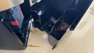 opening up the back of the De'Longhi TrueBrew CAM1025MB to clean