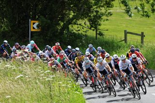 The women's peloton racing at the Women's Tour