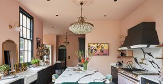 kitchen with black kicthen cabinets and pale pink walls and ceilings to show a best color for ceilings