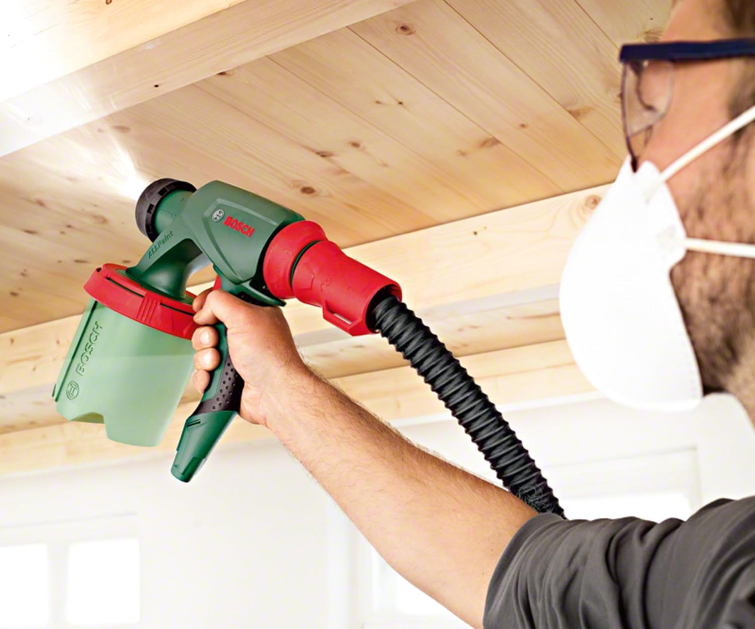 Bosch Home and Garden 603207170 Electric Paint Spray System being used in shed