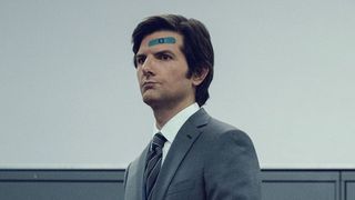 Adam Scott's Mark wears a blue plaster on his head in Severance on Apple TV Plus