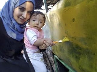 Film-maker Waad al-Kateab with baby daughter Sama in Aleppo