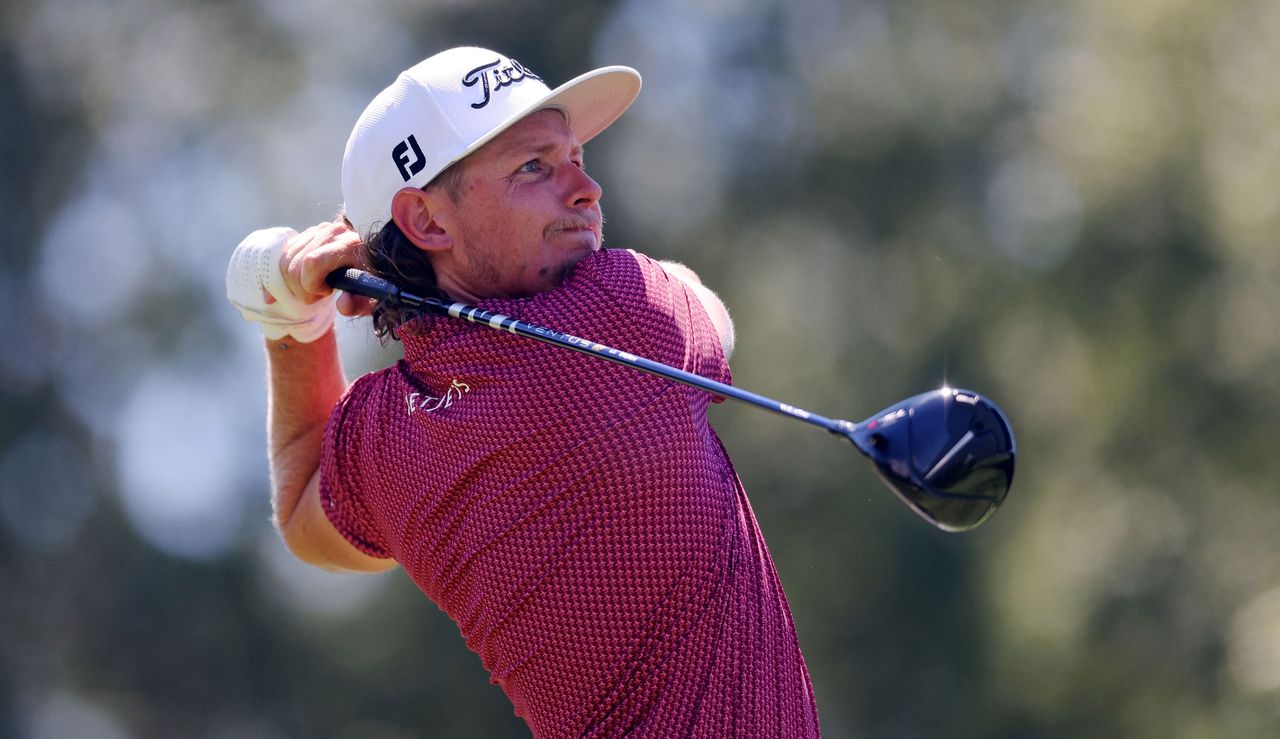 Cameron Smith watches his tee shot