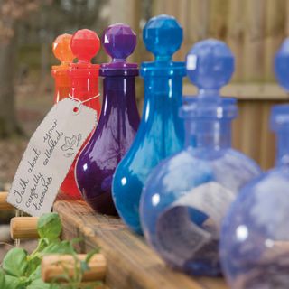 bottles used to make potions in a mud kitchen