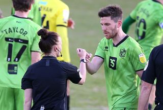 Welch, pictured with Port Vale’s Shaun Brisley, was congratulated by all the players after Monday's Sky Bet League Two match at Harrogate