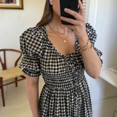 woman wears gingham dress