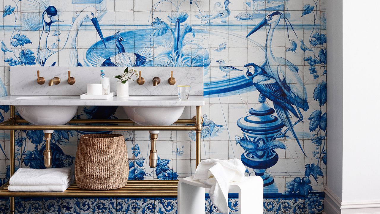 Blue and white bathroom tile idea with gold sink