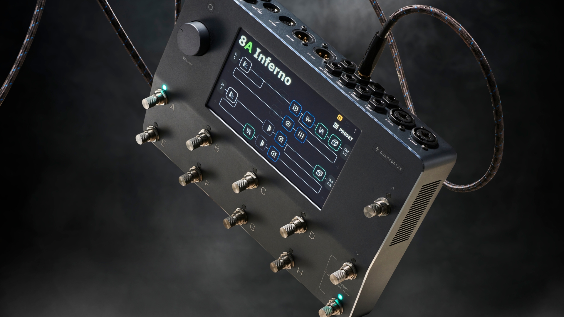 A Neural DSP Quad Cortex pedal amp floating in the air with a guitar cable