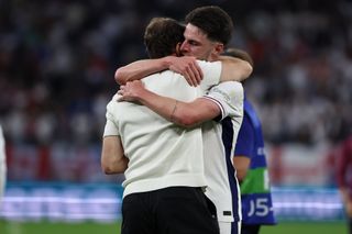 Declan Rice hugs Gareth Southgate after England's win over Slovakia at Euro 2024.