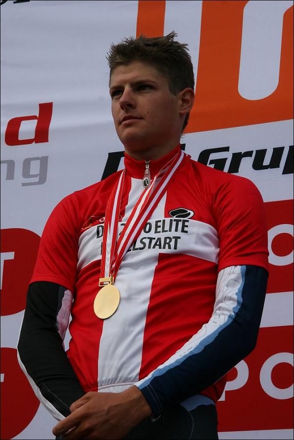 Jakob Fuglsang (Team Saxo Bank) listens to the Danish national anthem on the podium.