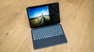 OnePlus Pad 3 and keyboard case on a wooden floor