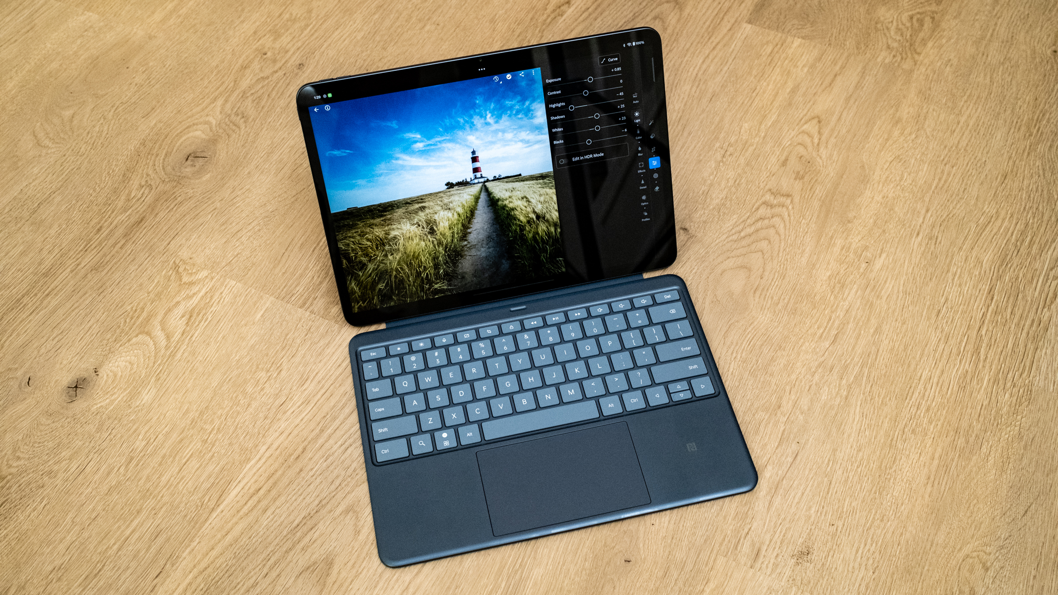 OnePlus Pad 3 and keyboard case on a wooden floor