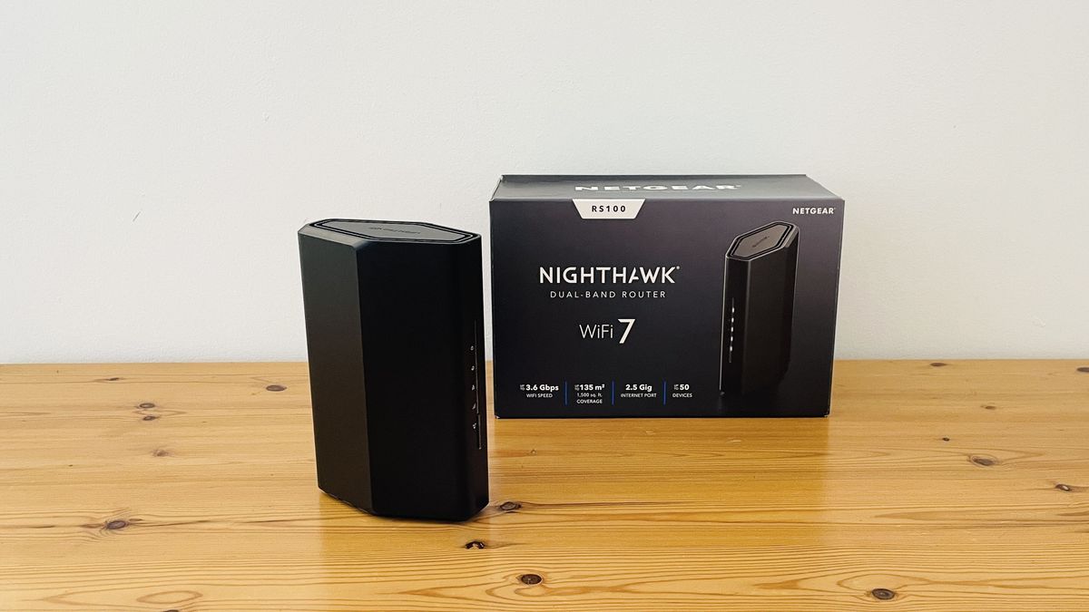 Netgear Nighthawk RS100 router on wooden table