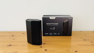 Netgear Nighthawk RS100 router on wooden table