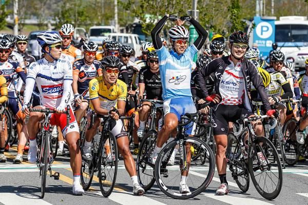 Riders await the start of stage five.