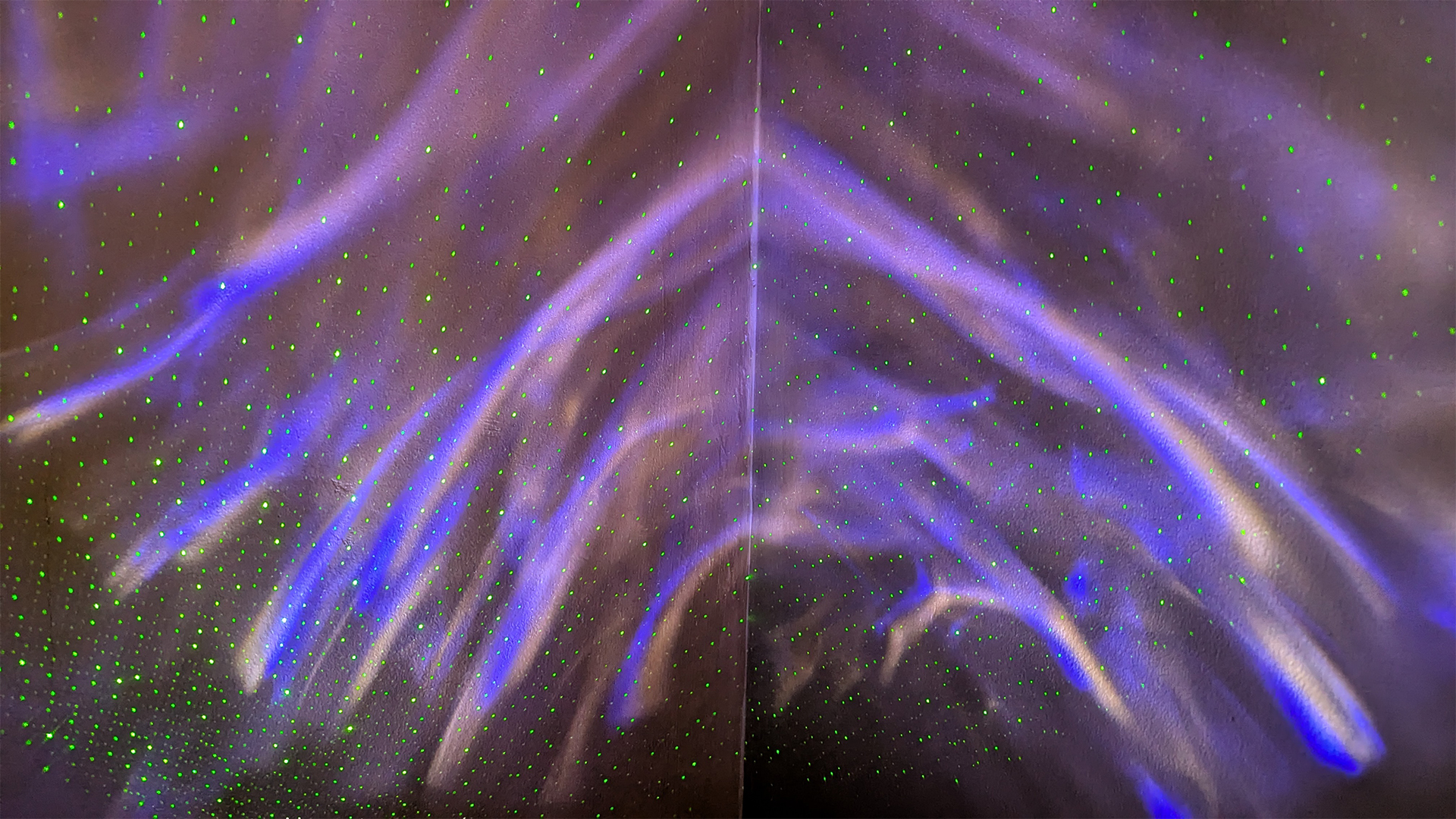 A demonstration of the YgiTK Northern Galaxy Lights Star Projector's lights and lasers