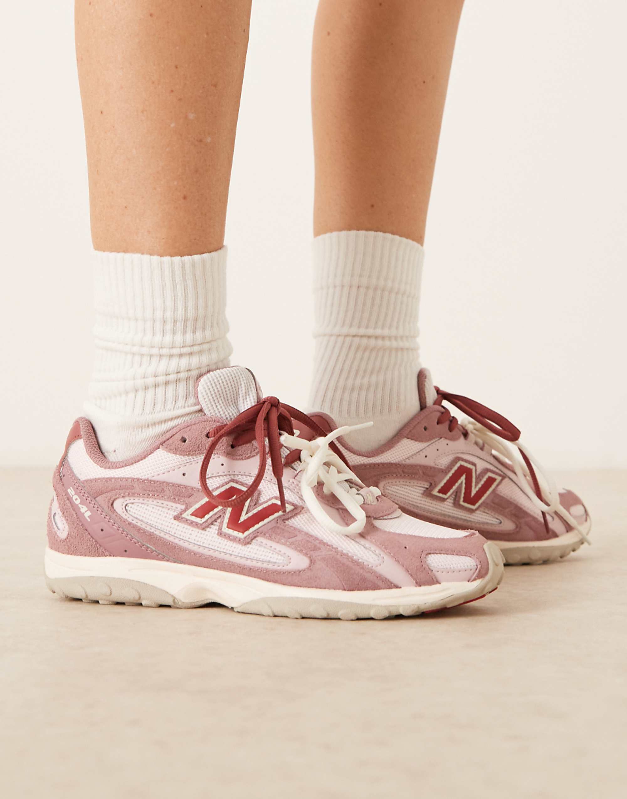New Balance 204l Trainers in Rose Pink Suede