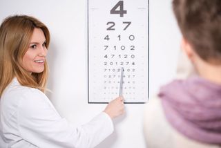 an optometrist has patient read an eye chart