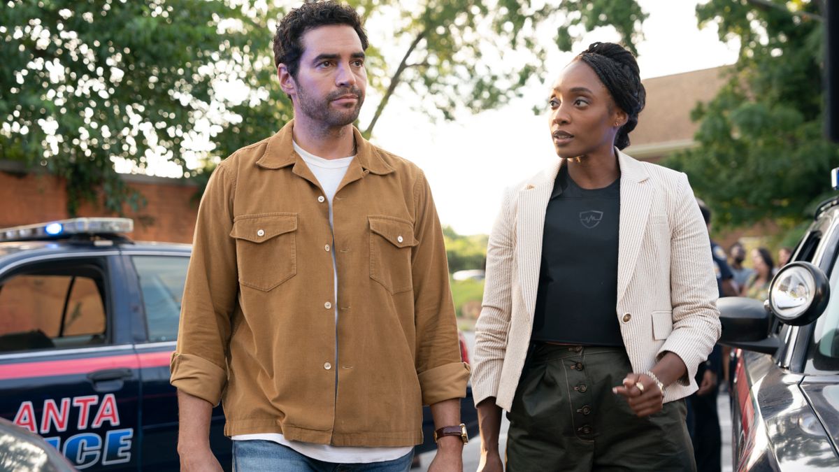 Ramon Rodriguez and Iantha Richardson walk onto a crime scene in mid-conversation in Will Trent S3 E1 - &quot;I&#039;m a Guest Here.&quot;