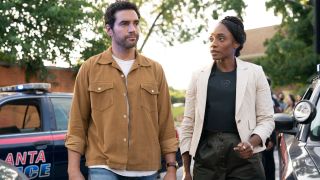 Ramon Rodriguez and Iantha Richardson walk onto a crime scene in mid-conversation in Will Trent S3 E1 - "I'm a Guest Here."