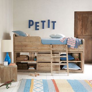 room with wooden door white walls and kids wooden bed loaf