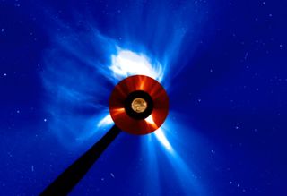 This massive coronal mass ejection whipped particles from the far side of the sun in September 2014, later generating gamma-rays that NASA's Fermi space telescope detected on the near side. This view comes from NASA's Solar Dynamics Observatory (center) and NASA/ESA's Solar and Heliospheric Observatory (red and blue).