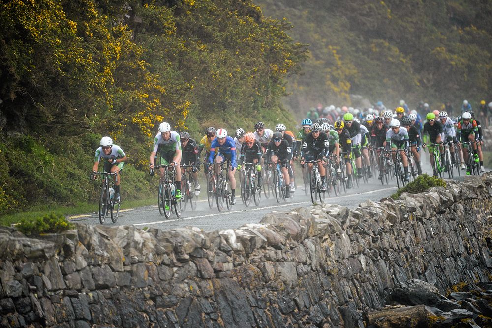 The peloton races through the rain during stage 5