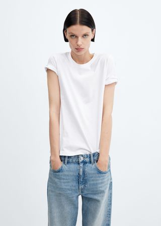 model wears white tee and jeans