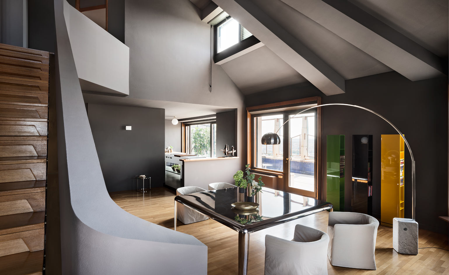 Open plan kitchen and living room with stair case to left