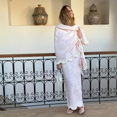 @silviadusci posing in pale pink posse brand fringed wrap matching skirt