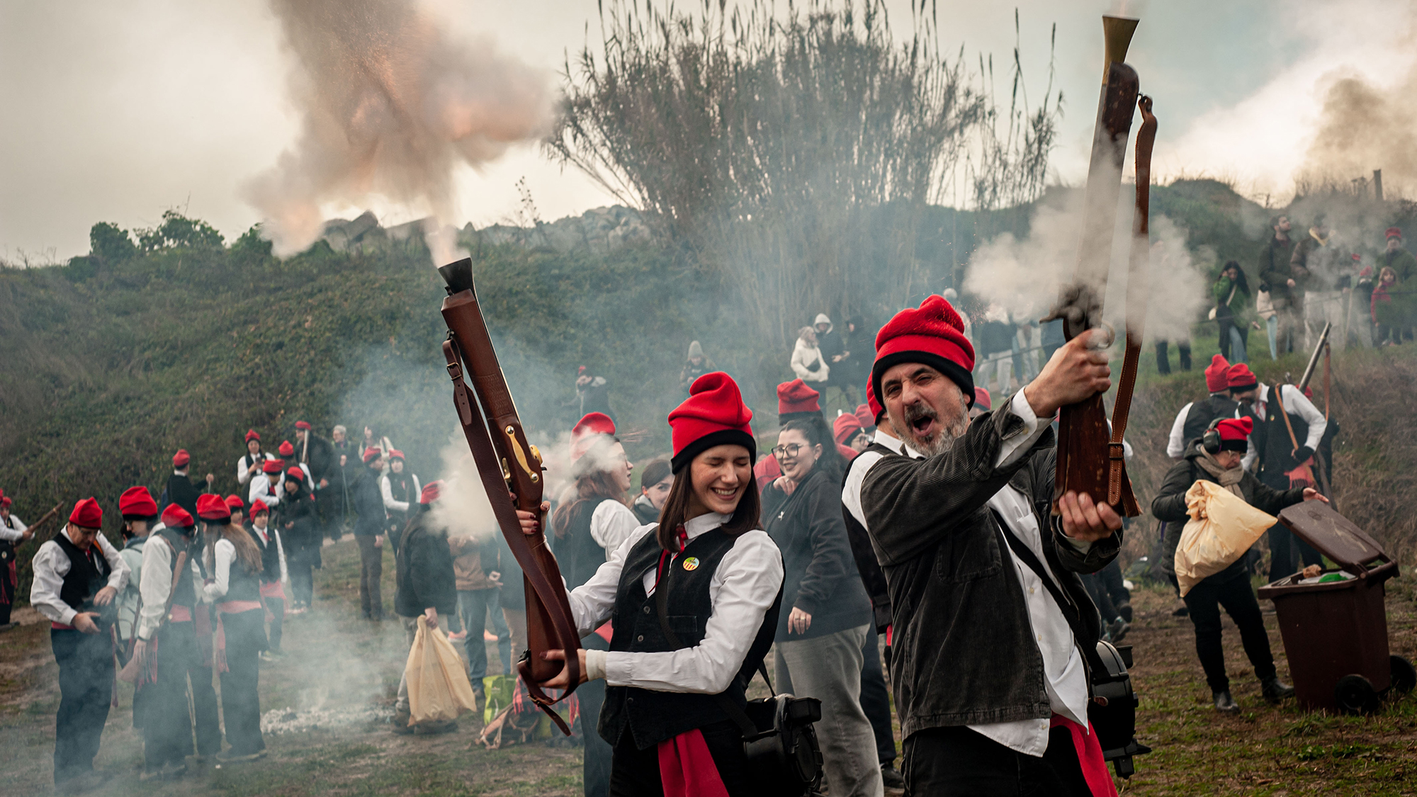 Galejadors dressed in traditional Catalan costume fire their muskets during the Pine Festival in Centelles, Spain