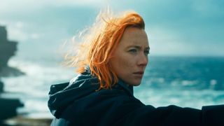 Rona (Saoirse Ronan) stands on the seafront in "The Outrun"