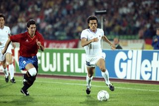 Kim Joo-Sung of South Korea gets away from Chendo of Spain at the 1990 World Cup.