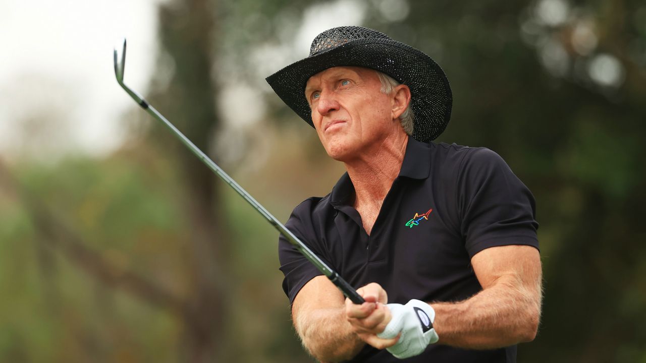 Greg Norman hits a golf shot