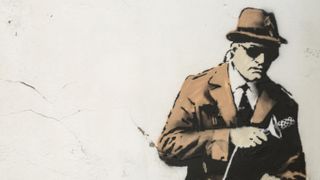 grafitti of a spy on a wall