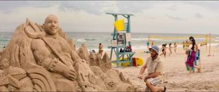 Sand sculpture of Dwayne Johnson in Baywatch