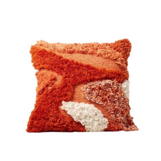 An orange fluffy pillow