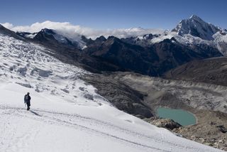 cordillera blanca, or the white mountains, in western peru with a climber