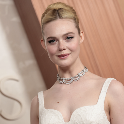 elle fanning wears givenchy at the 2025 oscars with a vintage cartier necklace