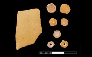 Beads made from ostrich eggshell hint at the buried woman's social status.