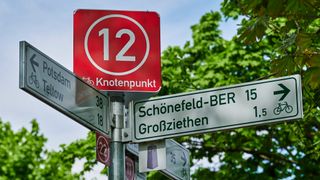 Information sign for cyclists on the Berlin Wall Trail between Berlin and Brandenburg with various tourist destinations.