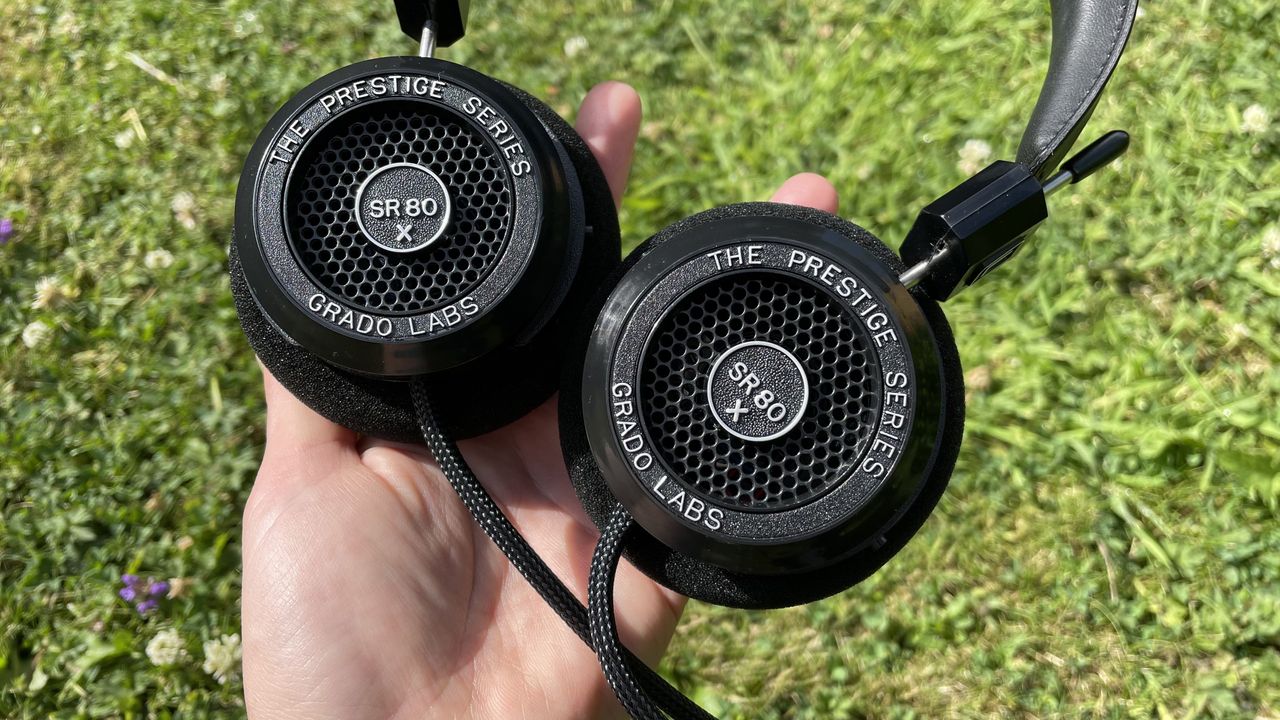 The Grado SR80x headphones against a grassy surface.