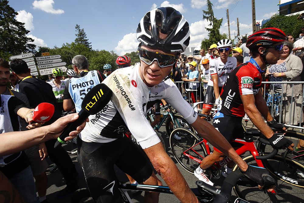 Chris Froome (Team Sky) loses time after crashing into a ditch during stage 1