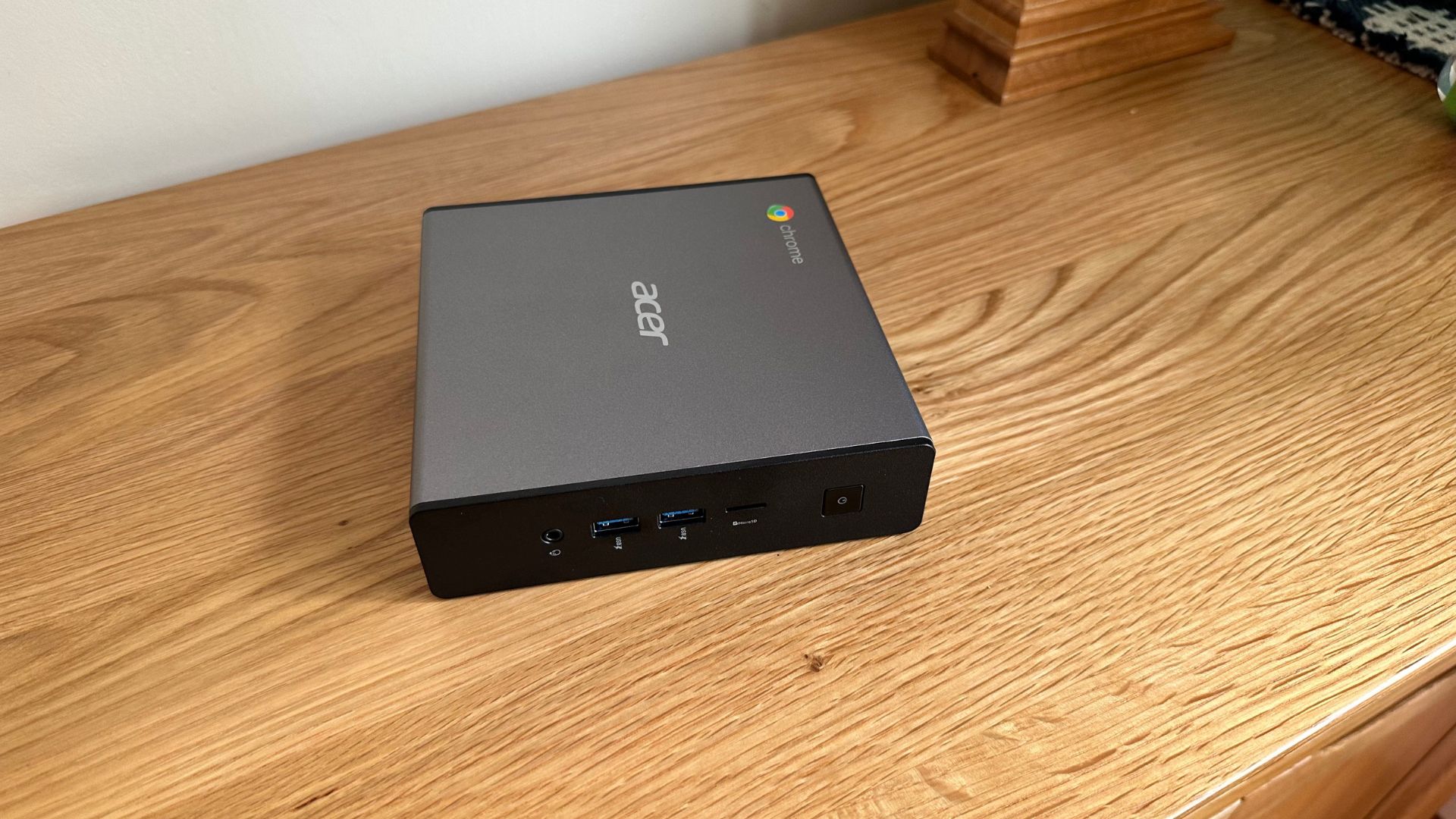Acer Chromebox mini PC on a wooden sideboard