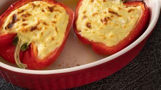 Stuffed bell peppers in a ceramic dish