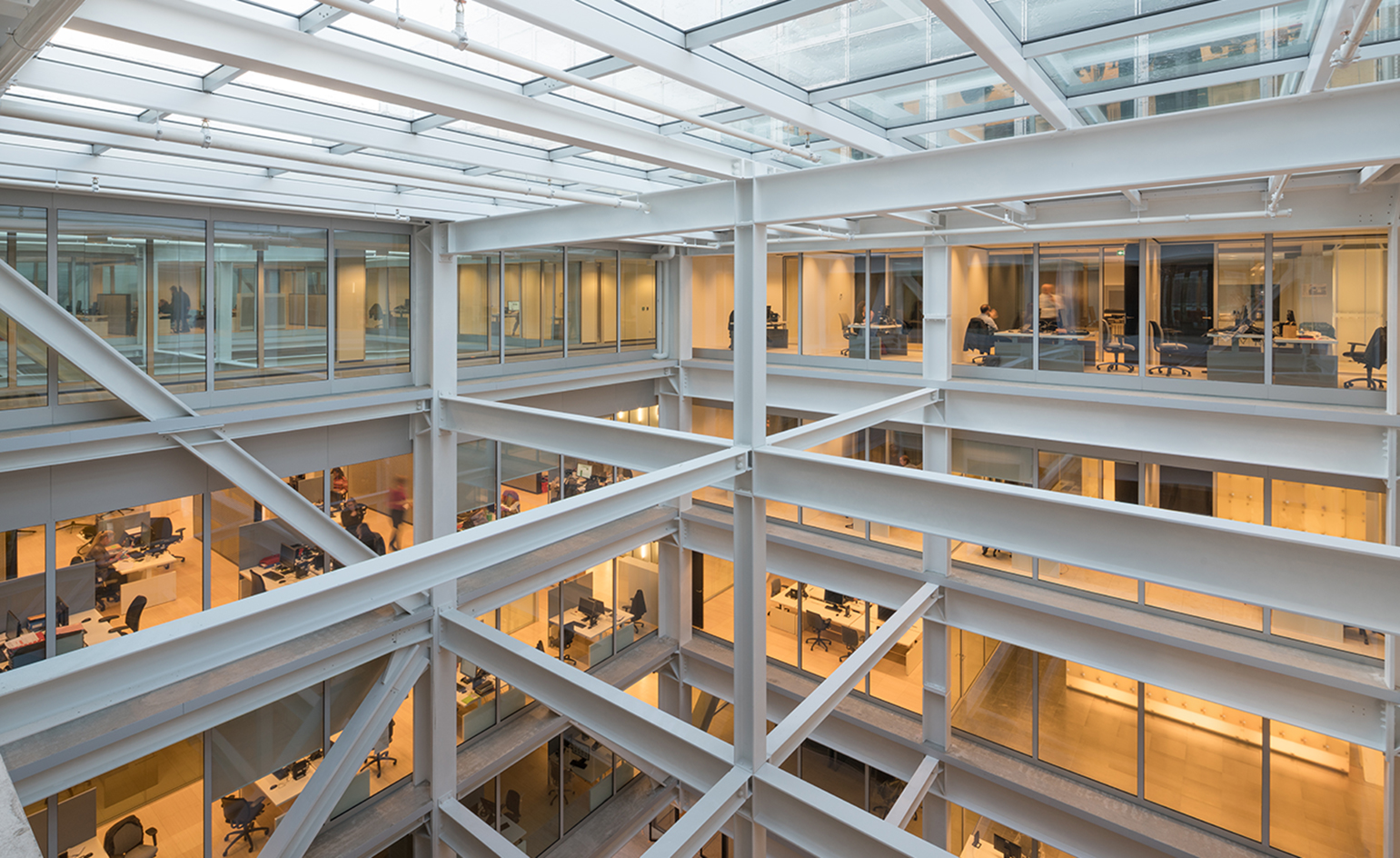 Metal white beams making up inside structure of a building