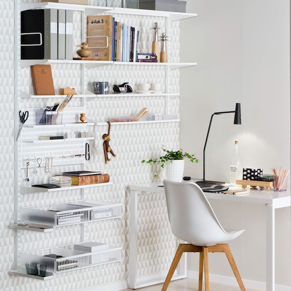 home office with white wall white desk with chair and white designed wall storage