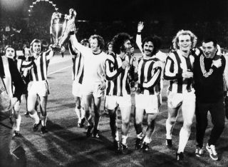 Bayern Munich players celebrate after beating Atletico Madrid in a European Cup final replay in 1974.